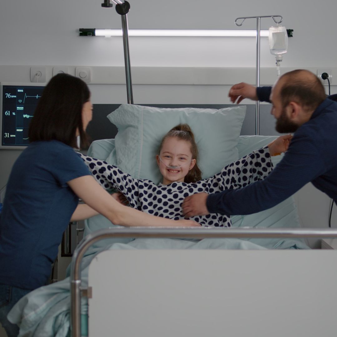 Child in a hopsital bed.